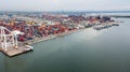 Aerial view of cargo ships loading containers at seaport