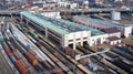 Aerial view of cargo trains. Railway wagons with goods on railroad. Top view of colorful freight train on the station