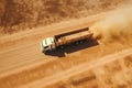 Aerial View Of Cargo Truck Transporting Grain On Dirt Road