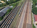 Aerial view on cargo wagons on train station in city Royalty Free Stock Photo