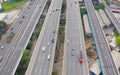Aerial view of cars driving on highway or moterway. Overpass bridge street roads in connection network of architecture concept.