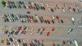 Aerial view of cars at large outdoor parking lots, USA. Outlet mall parking congestion and crowded parking lot, other cars try Royalty Free Stock Photo