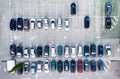 Aerial view on the cars on park place. View from drone on the carpark.