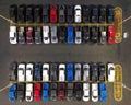 an aerial view of cars parked in a parking lot that is very neat