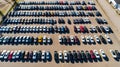 Aerial view Cars For Sale. Automotive Industry. Cars Dealership Parking Lot. Rows of Brand New Vehicles Awaiting New Owners Royalty Free Stock Photo