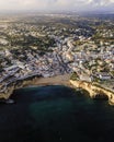 Aerial view of Carvoeiro township, a famous travel destination along the Ocean in the Algarve region, Carvoeiro, Portugal