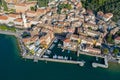 Aerial view of Castelletto di Brenzone at Garda Lake,  showing the coastline with roads and the tranquil coastal villages Royalty Free Stock Photo