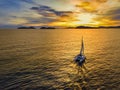 Aerial view of a catamaran on the andaman sea. Sunset sailing in Phuket, Thailand Royalty Free Stock Photo