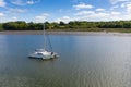 Aerial view of a catamaran sailing boat in the river Cleddau, Pembrokeshire, Wales