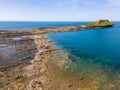 Aerial view of a causeway connecting the mainland to an island at low tide Worm`s Head, Wales Royalty Free Stock Photo