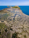 Aerial view of a causeway connecting to an island at low tide Worm`s Head, Rhossili, Wales Royalty Free Stock Photo