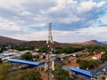 aerial view, cellular antenna at sunset, communications tower, mountain range Royalty Free Stock Photo
