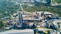 Aerial view of cement manufacturing plant. Concept of buildings at the factory, steel pipes, giants. Royalty Free Stock Photo