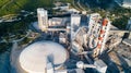 Aerial view of cement manufacturing plant. Concept of buildings at the factory, steel pipes, giants. Royalty Free Stock Photo
