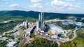 Aerial view of cement manufacturing plant. Concept of buildings at the factory, steel pipes, giants. Royalty Free Stock Photo