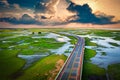 Aerial view of Chalerm Phra Kiat road at sunset in Thale Noi, Phatthalung, Thailand