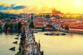 Aerial view of Charles Bridge, Prague Castle and Vltava river in Prague, Czech Republic during sunset time. World famous landmarks