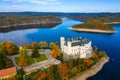 Aerial view chateau Orlik, above Orlik reservoir in beautiful autumn nature. Romantic royal Schwarzenberg castle above water level