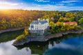 Aerial view chateau Orlik, above Orlik reservoir in beautiful autumn nature. Romantic royal Schwarzenberg castle above water level