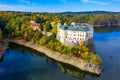 Aerial view chateau Orlik, above Orlik reservoir in beautiful autumn nature. Romantic royal Schwarzenberg castle above water level