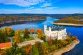 Aerial view chateau Orlik, above Orlik reservoir in beautiful autumn nature. Romantic royal Schwarzenberg castle above water level