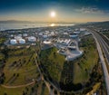 Aerial view of Chemical plant at sunset, oil refining, smoke, pipes, ecology pollution, air infection, coast of sea in