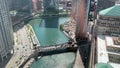 Aerial view of Chicago Loop and Chicago River, as skyscrapers cast shadows onto the river`s surface