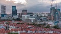 Aerial view of Chinatown with red roofs and Central Business District skyscrapers timelapse, Singapore Royalty Free Stock Photo