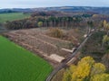 aerial view chopped Woodland new plantation Germany replanted with sapling deciduous trees protected with plastic tubes