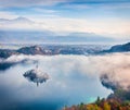 Aerial view of church of Assumption of Maria on the Bled lake. Foggy autumn landscape in Julian Alps, Slovenia, Europe. Beauty of Royalty Free Stock Photo