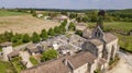 Aerial view of a church and cemetery in the French countryside, Rimons, Gironde