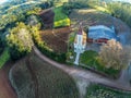 Aerial view of church, farm fields and forest