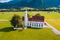 Aerial view of church near Schwangau with Alps in background