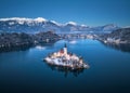 Aerial view of church, snowy island on the Bled Lake at night Royalty Free Stock Photo