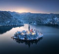 Aerial view of church, snowy island on the Bled Lake at night Royalty Free Stock Photo