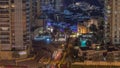 Aerial view of a road intersection between skyscrapers in Dubai marina night timelapse. Royalty Free Stock Photo