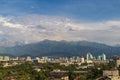 Aerial view of the city of Almaty immersed in greenery at the foot of the Zailiysky Alatau mountains