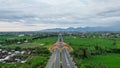 Aerial view of the city colorful Monument Tembolak Rainbow and Mataram City metro monument. The newest icon from the city of