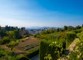 Aerial view of the city with historic center of Granada with some part of Alcazaba castle and Sierra Nevada on background Royalty Free Stock Photo