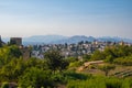 Aerial view of the city with historic center of Granada with some part of Alcazaba castle and Sierra Nevada on background Royalty Free Stock Photo