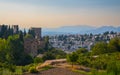 Aerial view of the city with historic center of Granada with some part of Alcazaba castle and Sierra Nevada on background Royalty Free Stock Photo