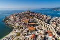 Aerial view the city of Kavala in northern Greek, ancient aqueduct Kamares, homes and medieval city wall