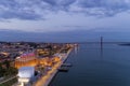 Aerial view of the city of Lisbon and the 25 of April Bridge on the background at dusk; Royalty Free Stock Photo