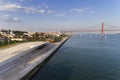 Aerial view of the city of Lisbon with the MAAT museum by the Tagus River and the 25 of April Bridge on the background; Royalty Free Stock Photo