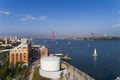 Aerial view of the city of Lisbon with sail boats on the Tagus River and the 25 of April Bridge on the background Royalty Free Stock Photo