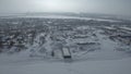 Aerial view of the city residential buildings and a river in winter, urban winter landscape. Clip. Snow covered city in Royalty Free Stock Photo