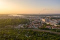 Aerial view of the city of rostock, railway tracks, river warnow and power plant chimney in the background