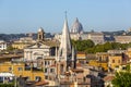 Aerial view of the city with Saint Peter`s Basilica in Vatican City in the distance and  and tower of All Saints` Church, Rome, Royalty Free Stock Photo