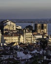 Aerial view of city skyline of Lisbon with the main cathedral and the Tagus river in the background during a beautiful sunset Royalty Free Stock Photo