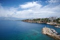 Aerial view of a city skyline, with several boats floating in the foreground in Antalya, Turkey. Royalty Free Stock Photo